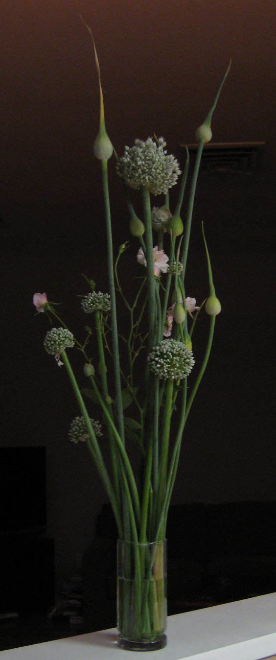 Leeks, onions & roses in a cut flower arrangement